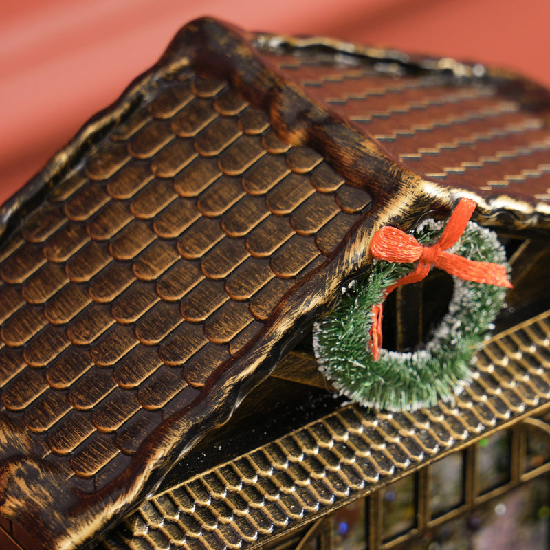 Close-up of the roof tiles and green wreath with red bow