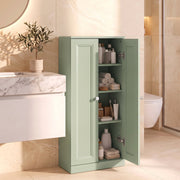 Light green bathroom cabinet in a bathroom with doors open and toiletries stored inside