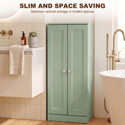 Light green bathroom cabinet with doors closed in a bathroom next to a freestanding bath