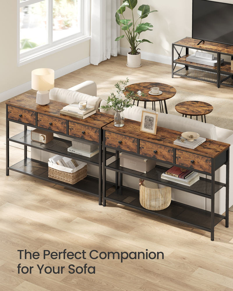 Two narrow console tables placed behind a sofa in a living room
