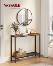 Rustic brown console table against a hallway wall below a round mirror, with a woven basket of books on the mesh shelf