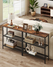 Two console tables placed together behind a sofa in a living room setting