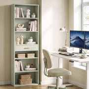Light green narrow bookcase used as home office storage beside a desk
