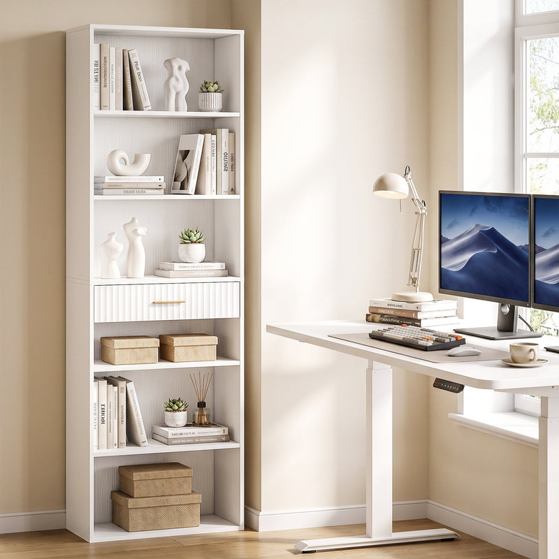 White narrow bookcase used as home office storage beside a desk