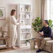 White bookcase in a living room with a couple relaxing nearby
