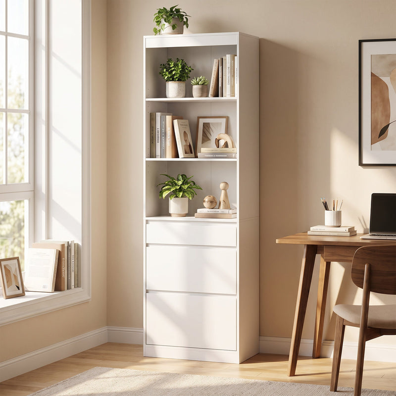 White narrow bookcase beside a window and wooden desk, styled with books, plants and framed prints