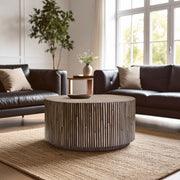 Bamboo sunburst coffee table styled with a tray in an open-plan lounge