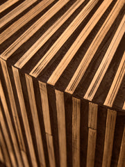 Round bamboo coffee table anchoring a family seating area