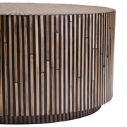 Macro close-up of hand-laid bamboo strips radiating from the centre of the top