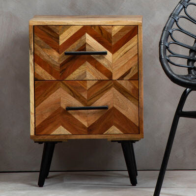 Natural mango wood 2-drawer bedside table with black iron legs styled beside a bed