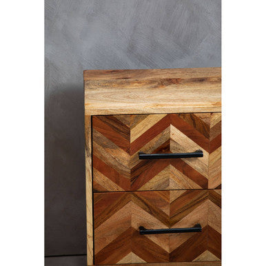 Pair of mango wood bedside tables placed either side of a bed in a styled room