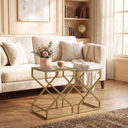 Nesting tables styled beside a sofa with flowers, coffee cup and magazines
