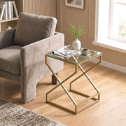 Side table used beside an armchair with a vase and magazine