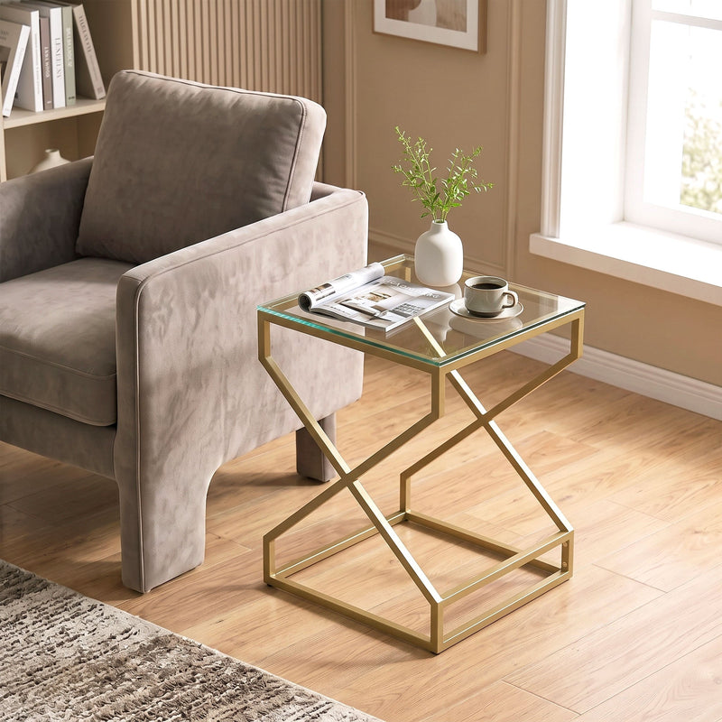 Side table used beside an armchair with a vase and magazine