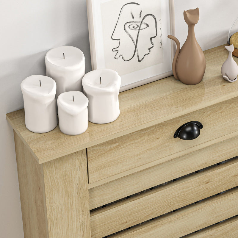 Close-up of the drawer handle and wood-grain tabletop surface with decorative ornaments