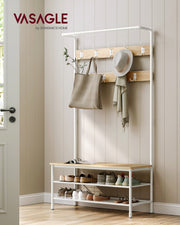 Coat rack stand styled by a front door with a bag, scarf and hat hanging