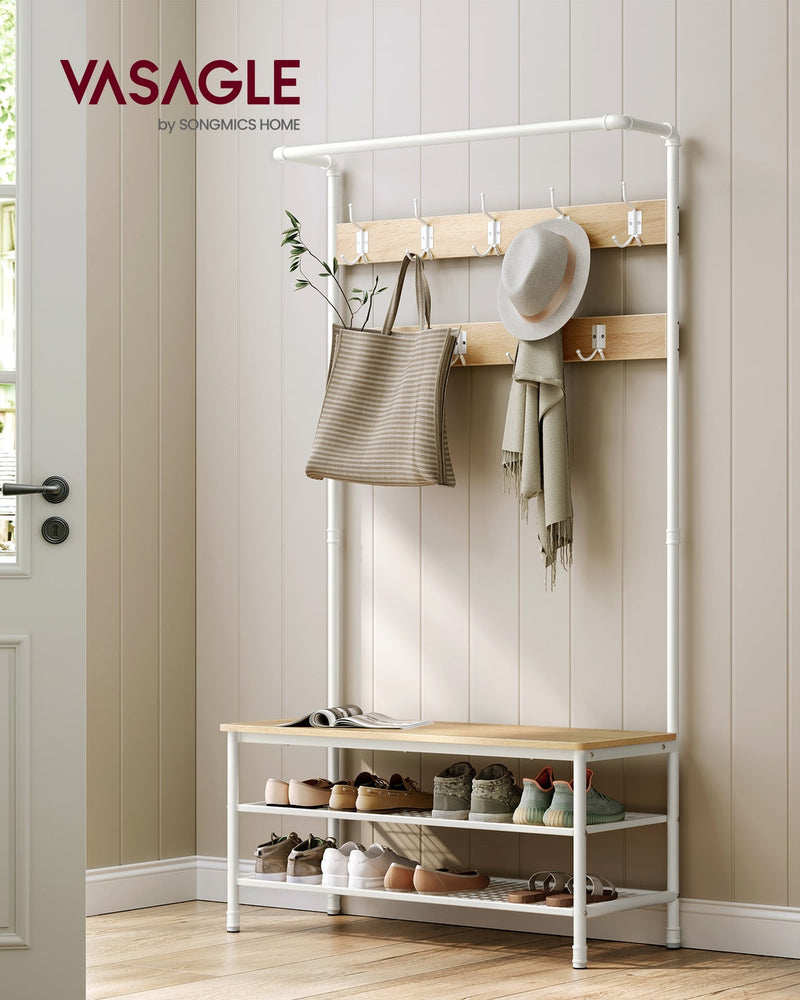 Coat rack stand styled by a front door with a bag, scarf and hat hanging