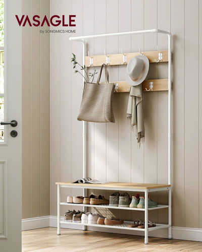Coat rack stand styled by a front door with a bag, scarf and hat hanging