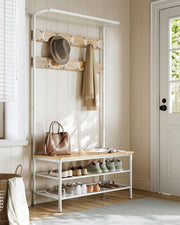 Coat rack stand in a hallway entryway beside a front door with shoes on the shelves