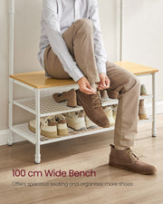 Person sitting on the 100 cm wide bench tying shoe laces