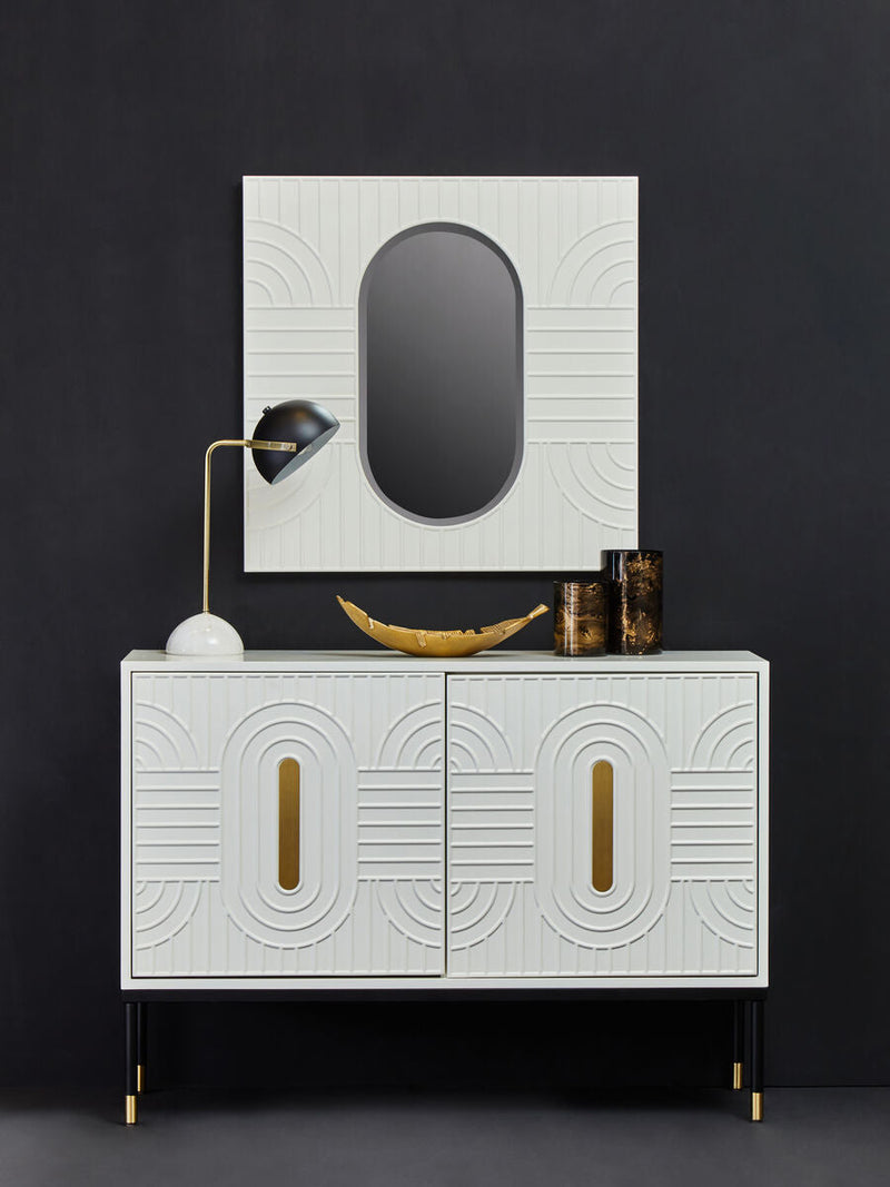 Off-white sideboard with black base and gold accents in a lifestyle setting