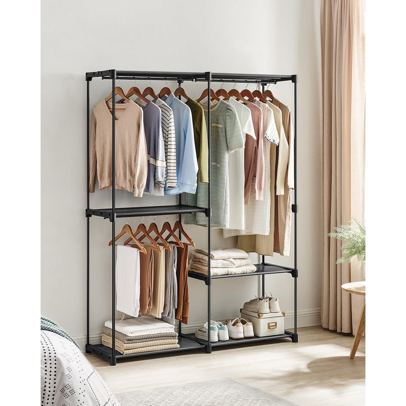 Open clothes rack in a bedroom holding coats, shirts and shoes on its shelves