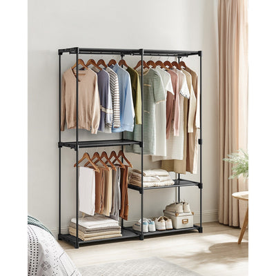Open clothes rack in a bedroom holding coats, shirts and shoes on its shelves