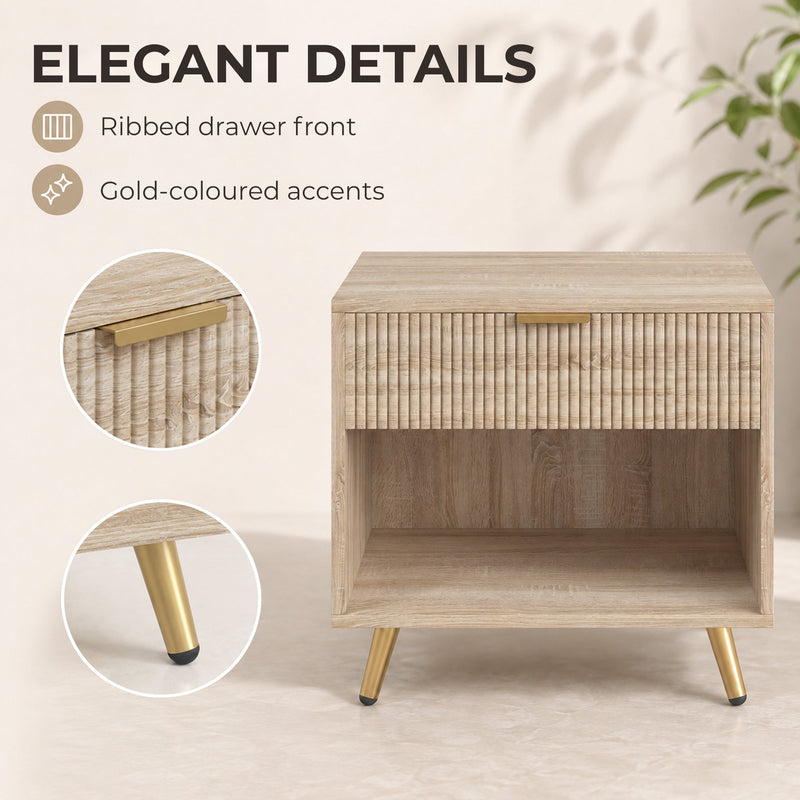 Close-up of the ribbed drawer front and gold-tone handle and leg on the natural wood bedside table