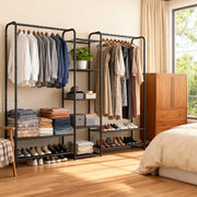 Matt black clothes rack beside a wooden chest of drawers in a bright bedroom with a window