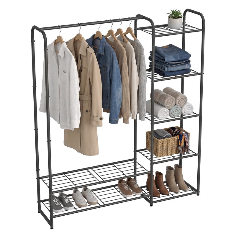 Clothes rack holding hanging jackets, folded jeans, towels and rows of shoes