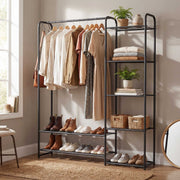 Matt black clothes rack in a bedroom corner beside a tall round mirror