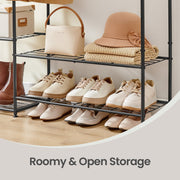 Close-up of the lower shelves holding shoes, a handbag and a folded hat