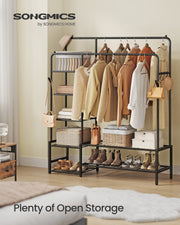Clothes rack shown in a bedroom holding hanging garments