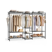 Black steel open wardrobe with three sections, styled with hanging beige and cream clothing, shoes on the bottom shelf, and storage boxes on top.