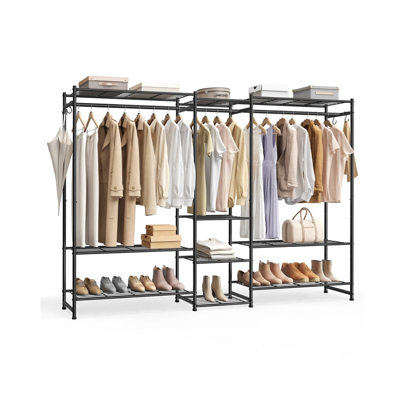Black steel open wardrobe with three sections, styled with hanging beige and cream clothing, shoes on the bottom shelf, and storage boxes on top.