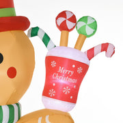 Close-up of the Merry Christmas cup of sweets held by the gingerbread man