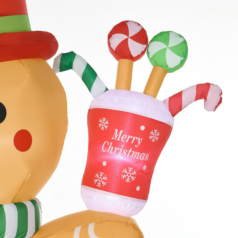 Close-up of the Merry Christmas cup of sweets held by the gingerbread man