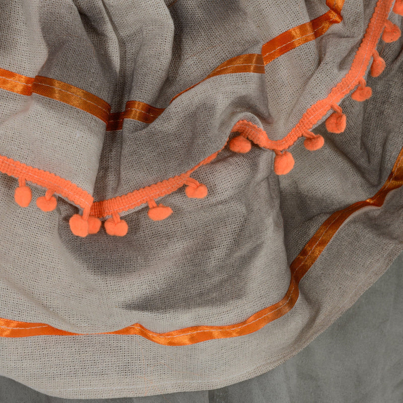 Close-up of the orange pom-pom trim on the robe of the Homcom orange clown animatronic