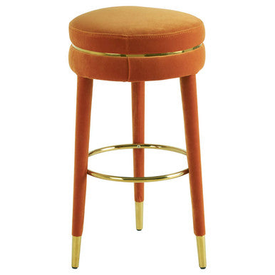 Side view of orange velvet bar stool with gold finish footrest