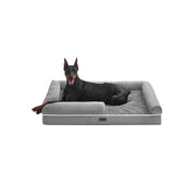 Feandrea orthopaedic dog bed in light grey, studio shot with a Doberman resting on the raised bolster sides