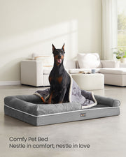 Close-up of the light grey plush cover and raised bolster edge on the Feandrea orthopaedic dog bed