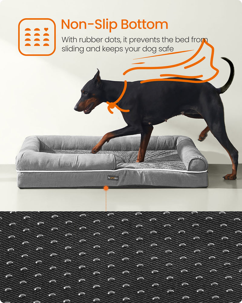 Large dog stretched out comfortably on the light grey orthopaedic dog bed