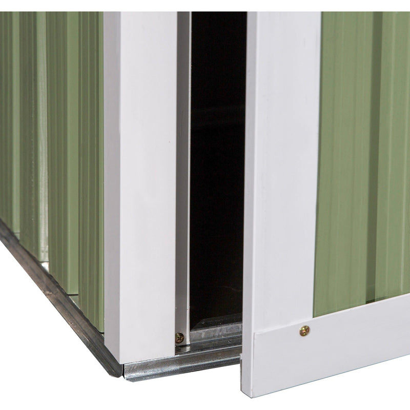 Close-up of the door bottom edge and base rail with the door standing open