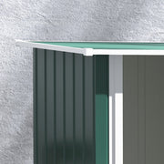 Close-up of the roof edge overhanging the green wall panels