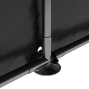 Close-up of a steel frame leg on its base plate anchored through the cover
