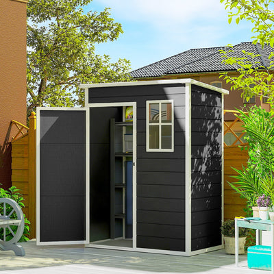 The black plastic shed in a garden with its door open, showing shelves and stored items inside