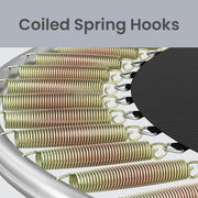 Close-up of coiled springs hooked between the steel frame and the black jumping mat