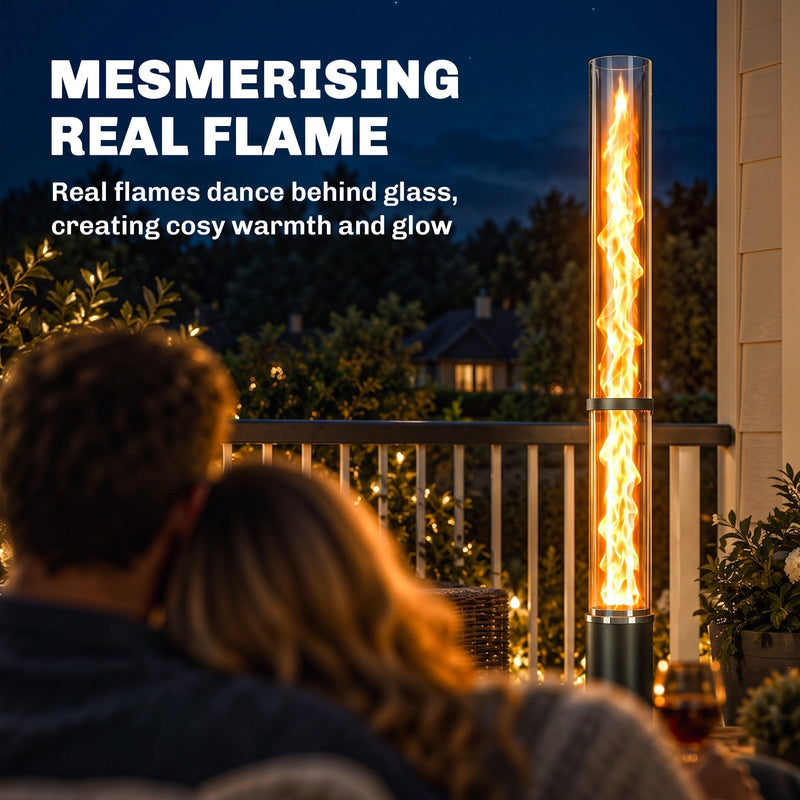 Couple watching the real flame inside the pellet heater's glass tube at night