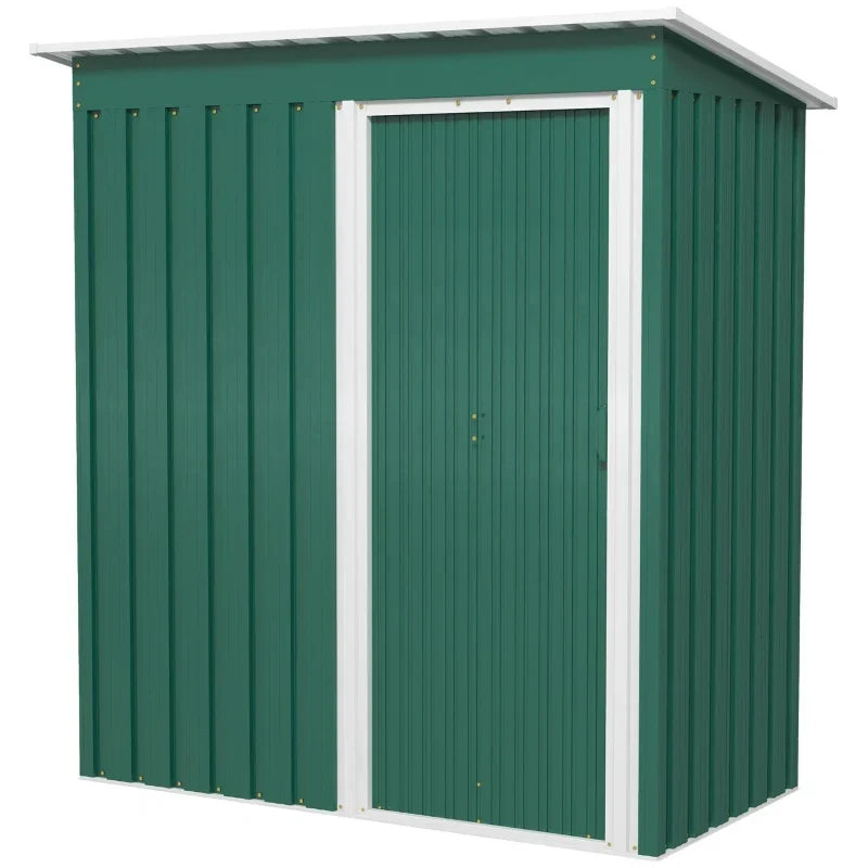Front view of the green shed with the white-framed sliding door closed on a plain background