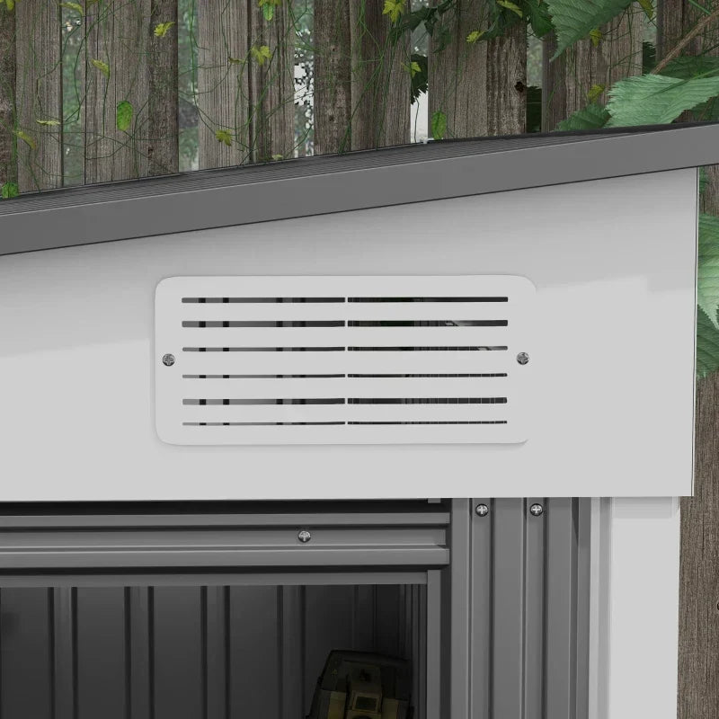 Close-up of the louvred ventilation panel above the sliding doors on the white steel wall